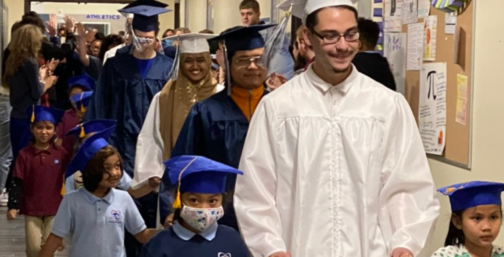 Utica Academy of Science high school’s graduating Class of 2022 donned their caps and gowns and walked the halls of where it all started: Elementary School.